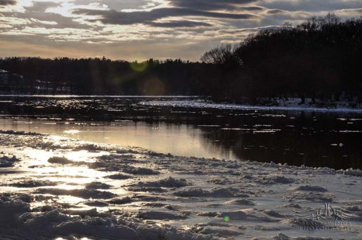 Looking upriver, the scene is shadowed by the anticipated sunset.